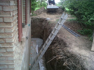 1 Excavate wall and pour wider footing New gravel